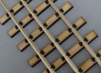 three rail track, wooden ties 0/0e