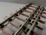 three rail track, wooden ties 0/0m